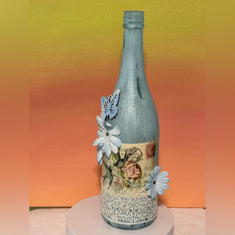 Decorative Blue Bottle with Floral Accents Handcrafted
